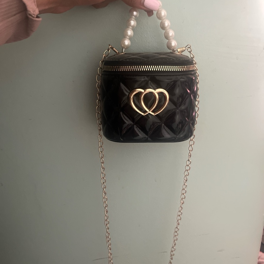 Elegant Black Quilted Bag with Gold Accents